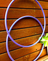 Purple 2-in-1 polypro hula hoop configured as a full-size on-body hoop.