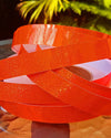 Orange glitter hula hoop tape with rainbow shine, used to decorate and customise hula hoops